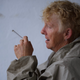 Trainer Hazel Copeland takes a drag from her cigarette